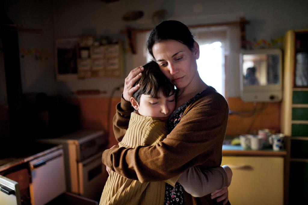 sad-mother-hugging-son 