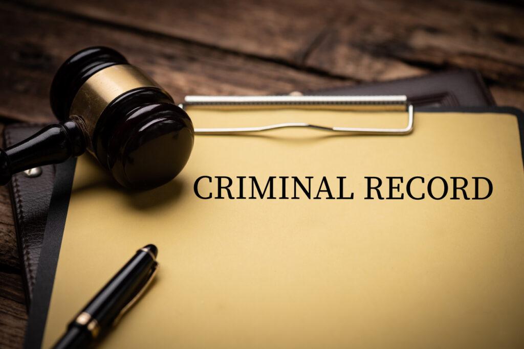 criminal-record-text-on-yellow-document