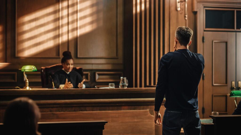 man-giving-testimony-to-judge