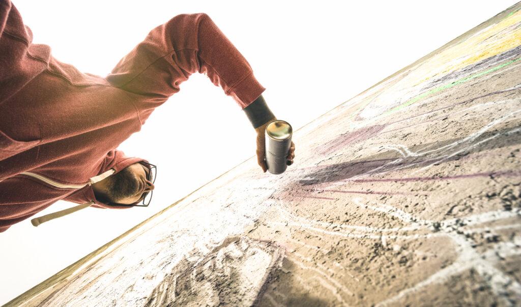 Man painting on generic wall.
