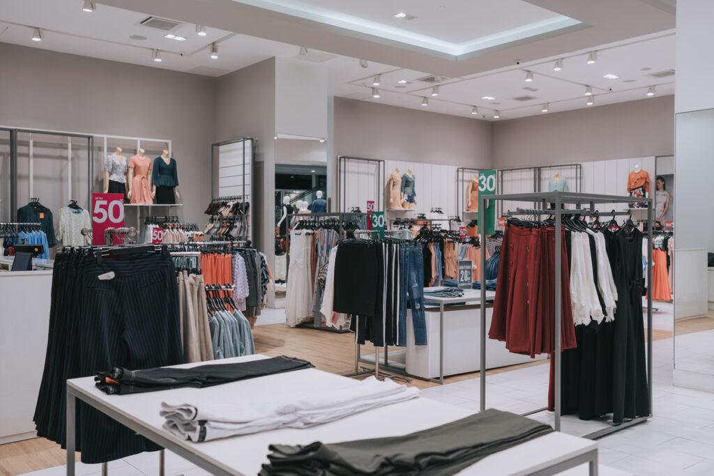 Clothing store retail display with discount sales tag.