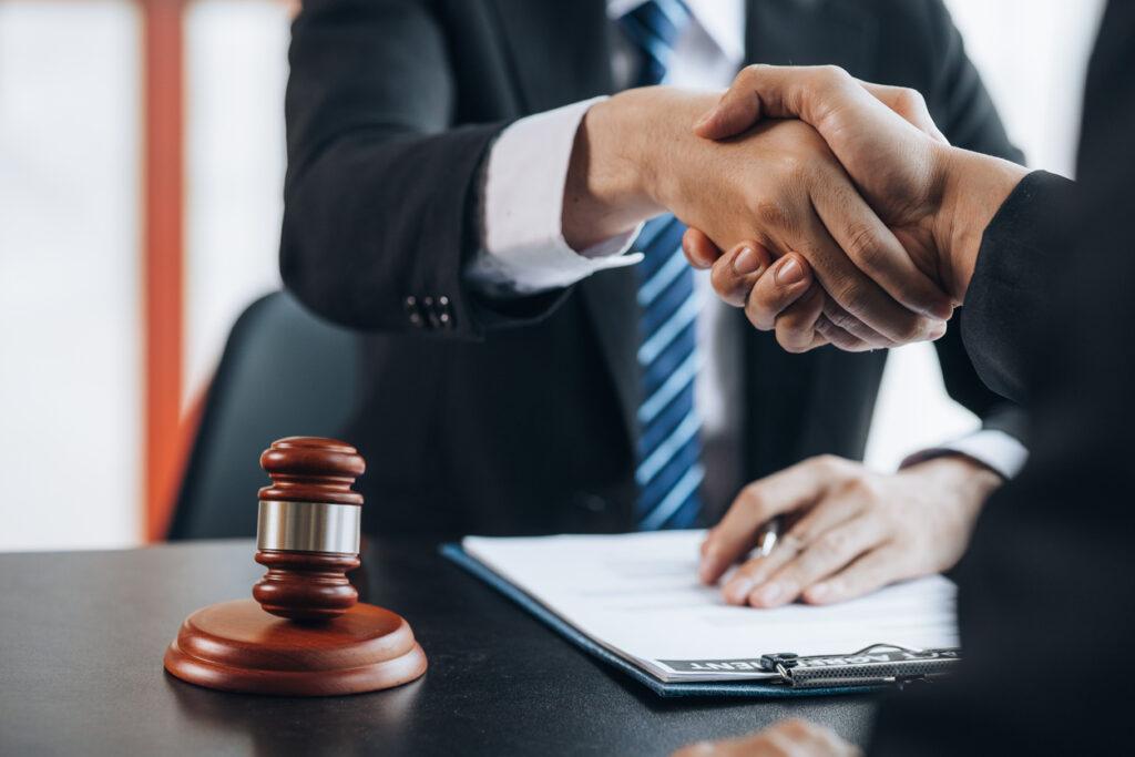 Man shaking hands with a criminal defense attorney.