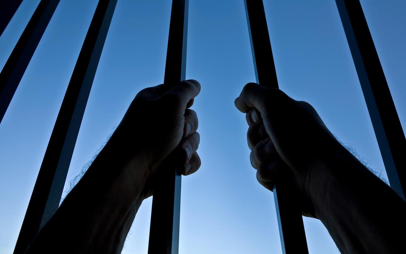 Man behind bars.