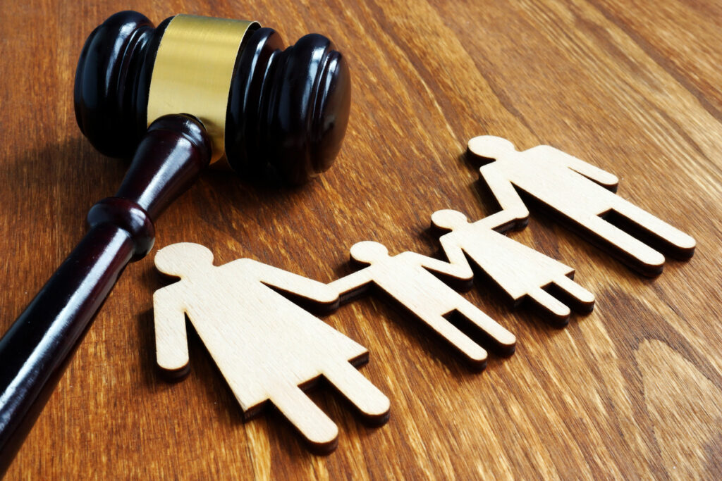 Wooden figures and gavel on the table.
